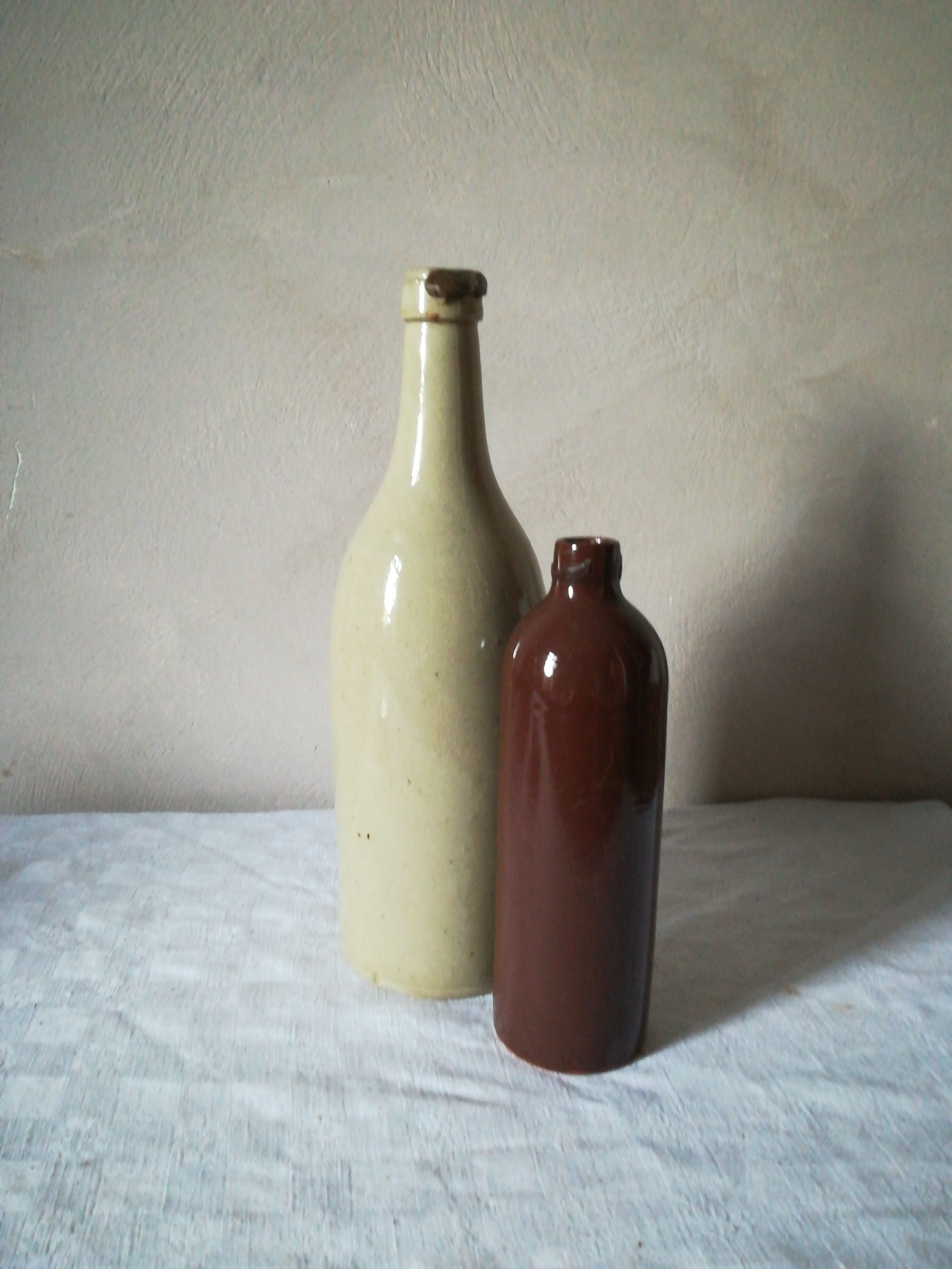 2 sandstone bottles