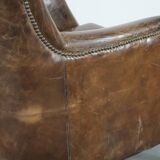Very comfortable vintage cow leather armchair with beautiful colours