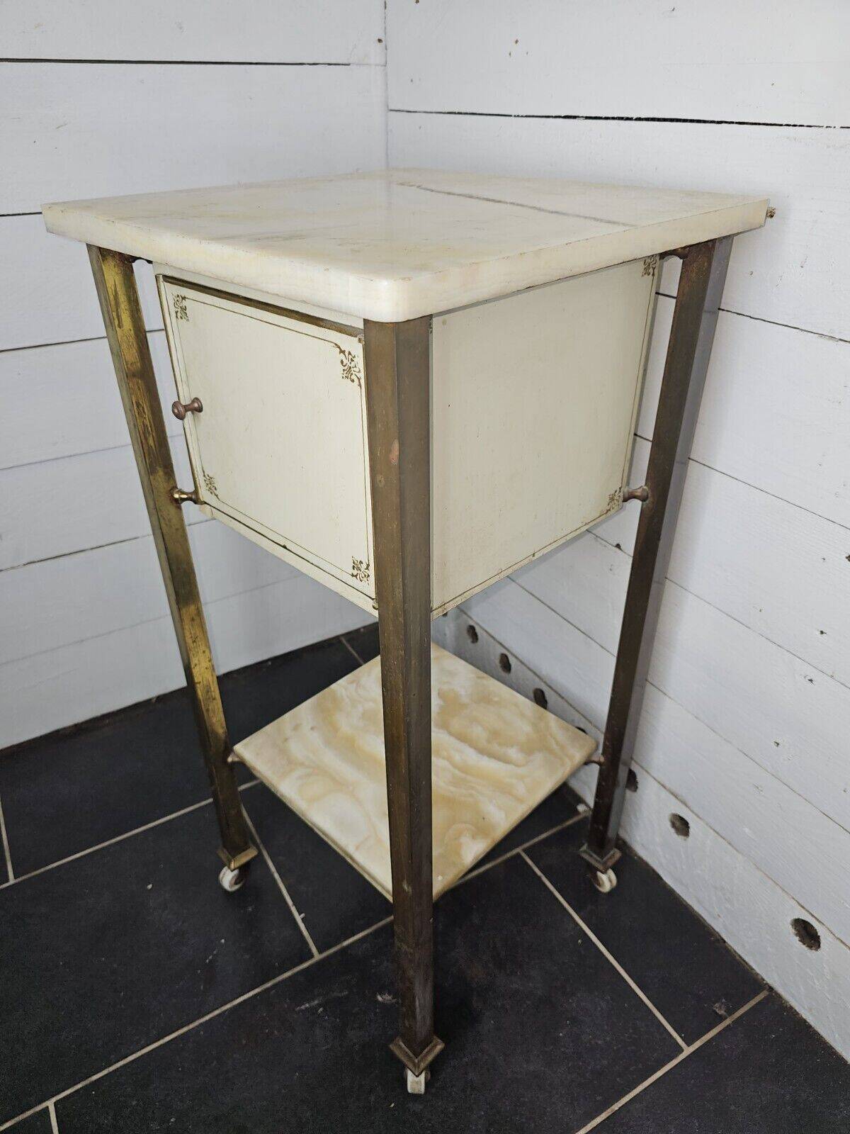 Bedside table in patinated iron, brass and marble tops