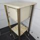 Bedside table in patinated iron, brass and marble tops