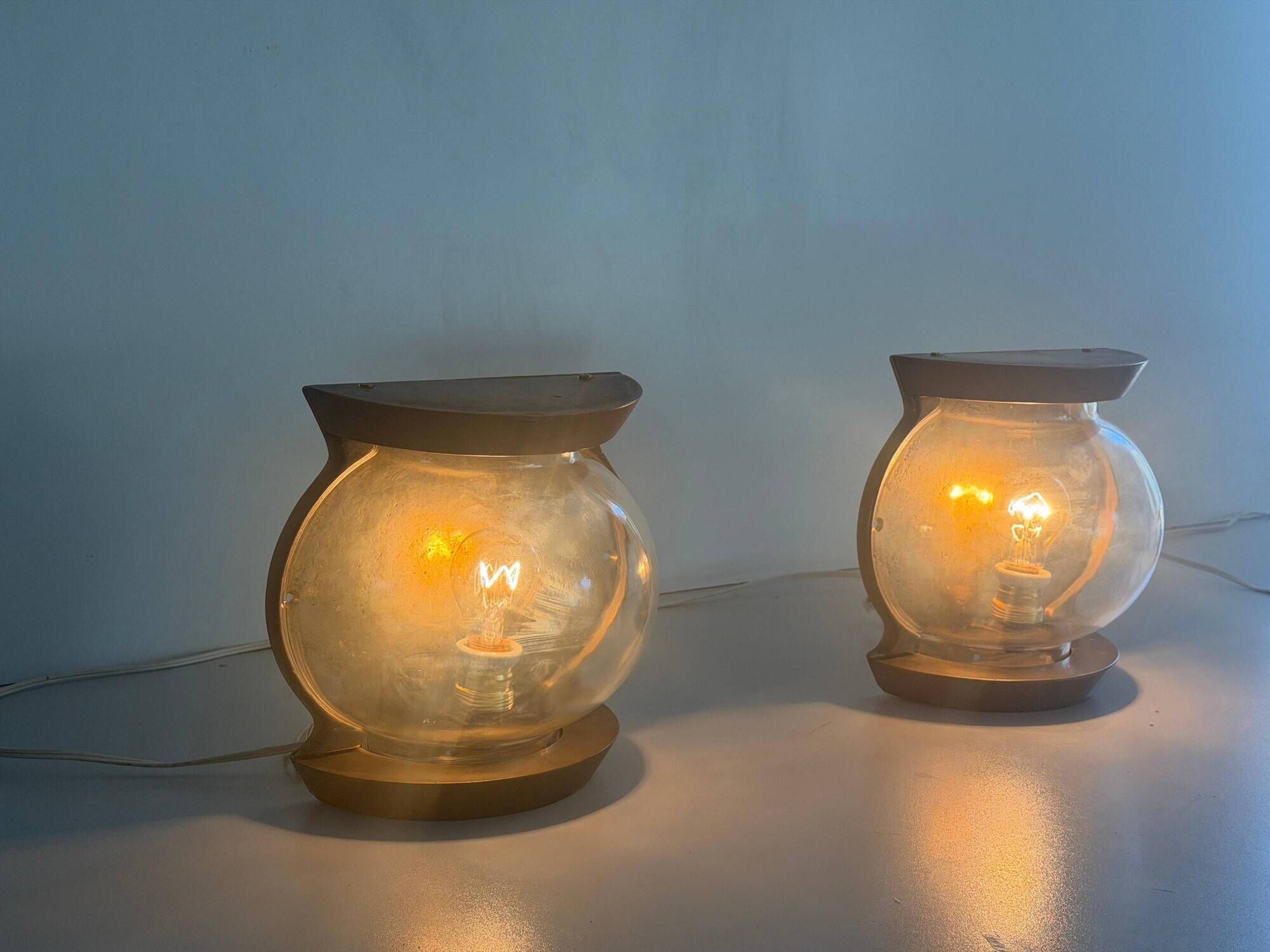 Pair of bronze and glass wall lights from the mid-century, 1960, Italy.