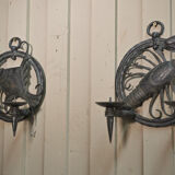 Pair of carved metal wall lamps signed RG
