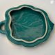 Grained in the shape of vintage dark green enamelled ceramic sheet