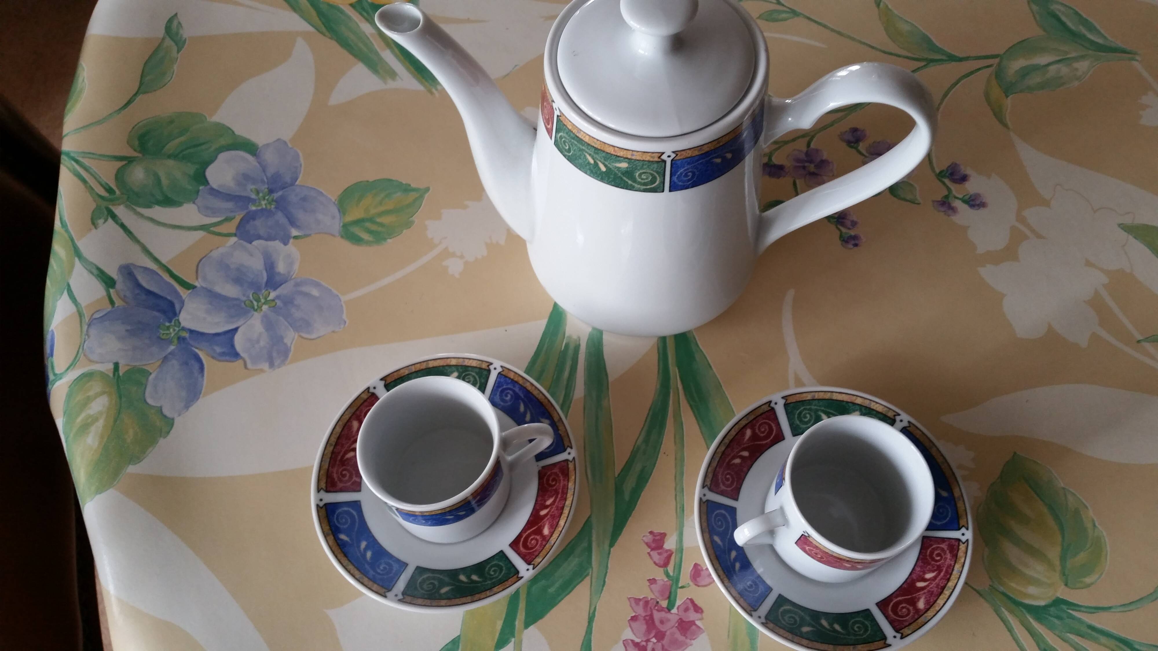 Coffee service cups saucers and coffee maker