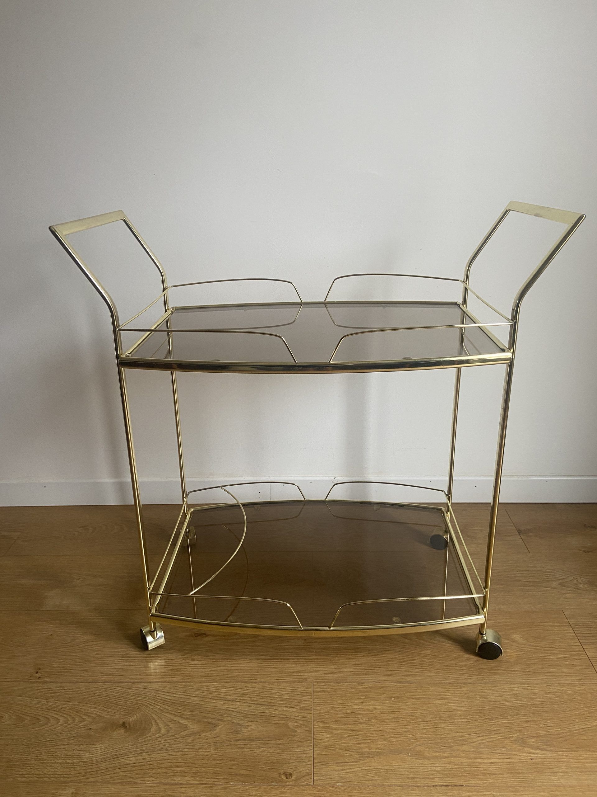 Vintage rolling service in gilded metal and smoked glass