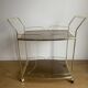Vintage rolling service in gilded metal and smoked glass