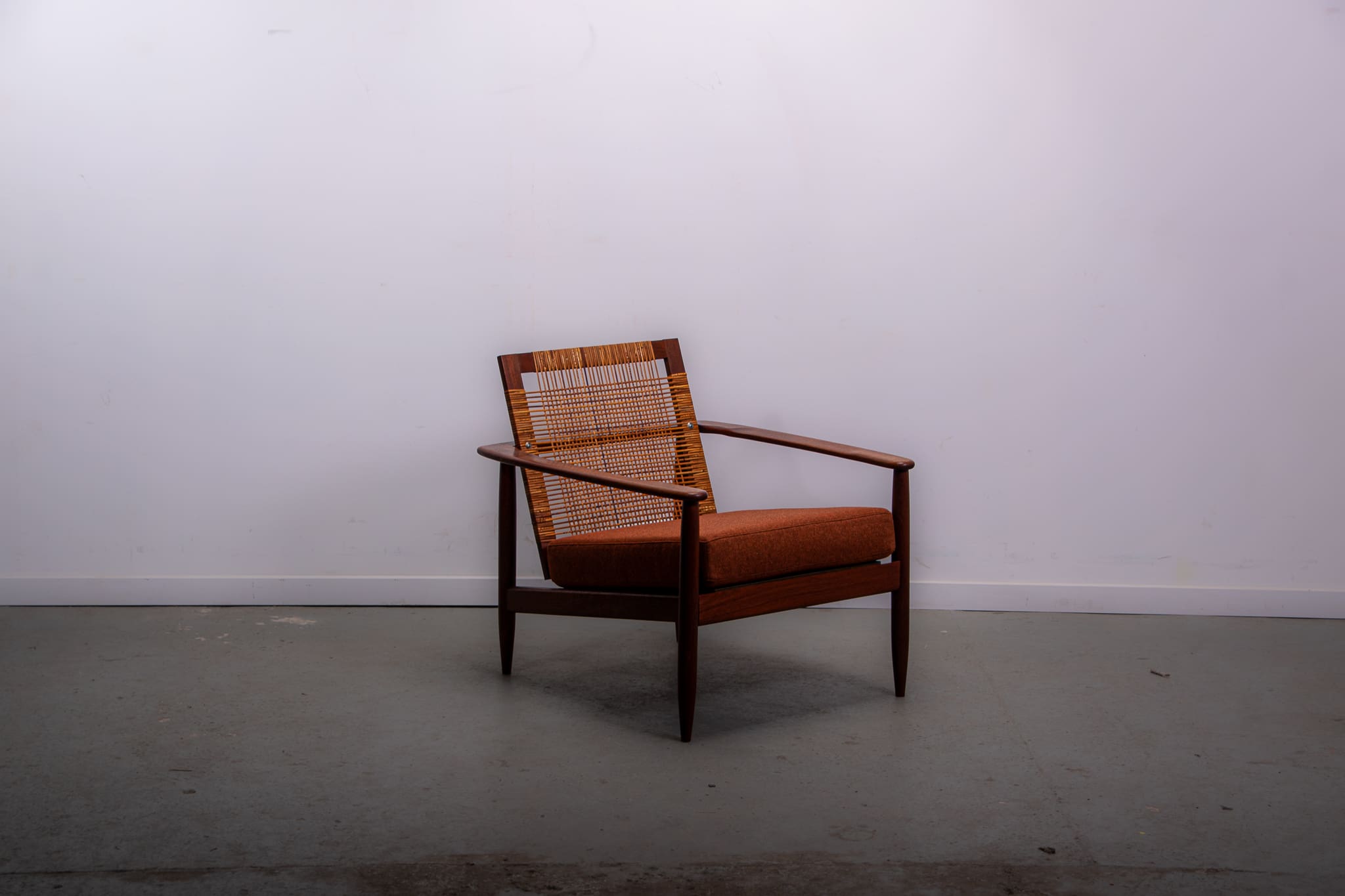 Mid-century easy chair in teak and cane circa 1970