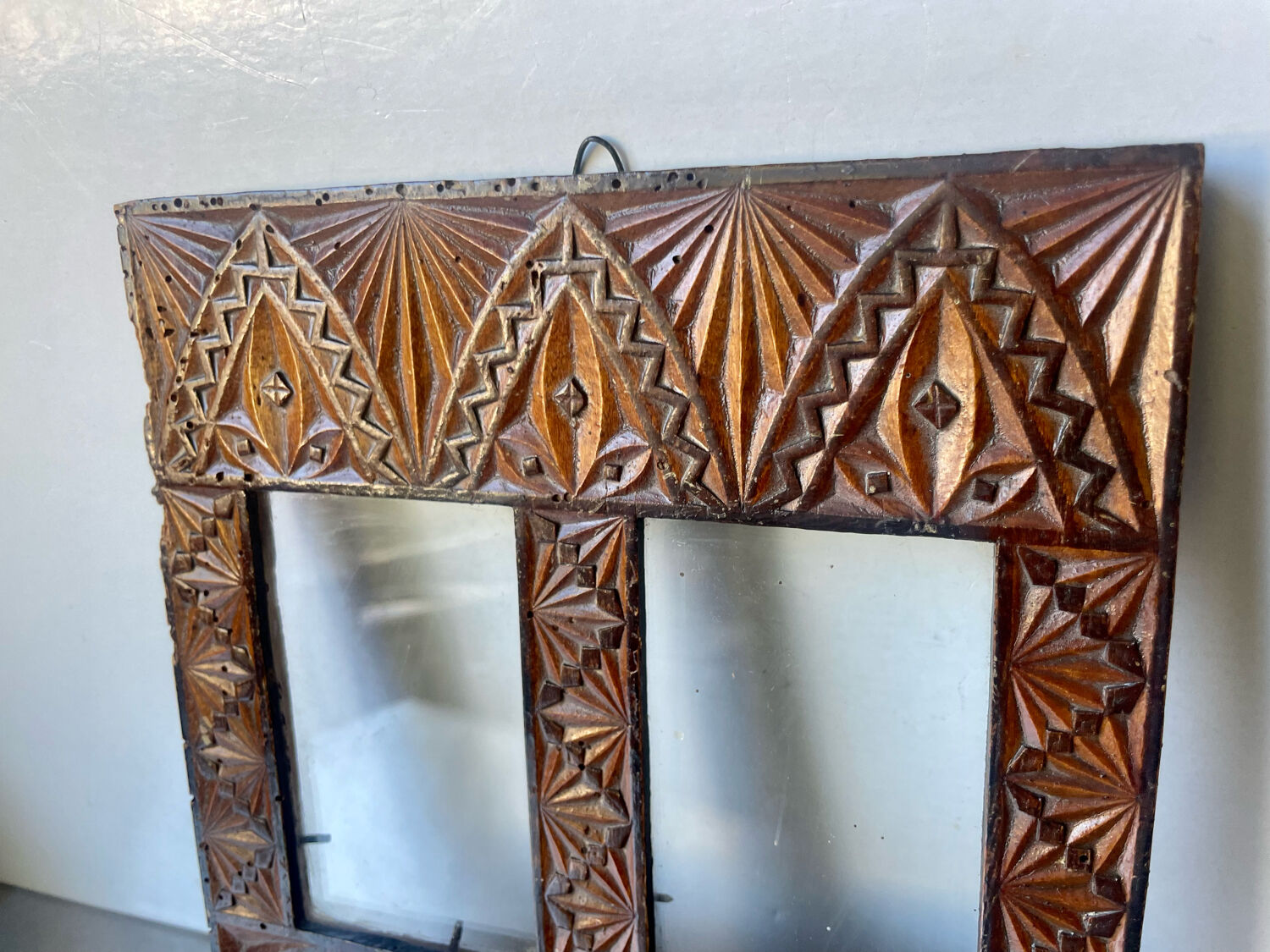 Double frame intricately carved wood