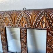 Double frame intricately carved wood