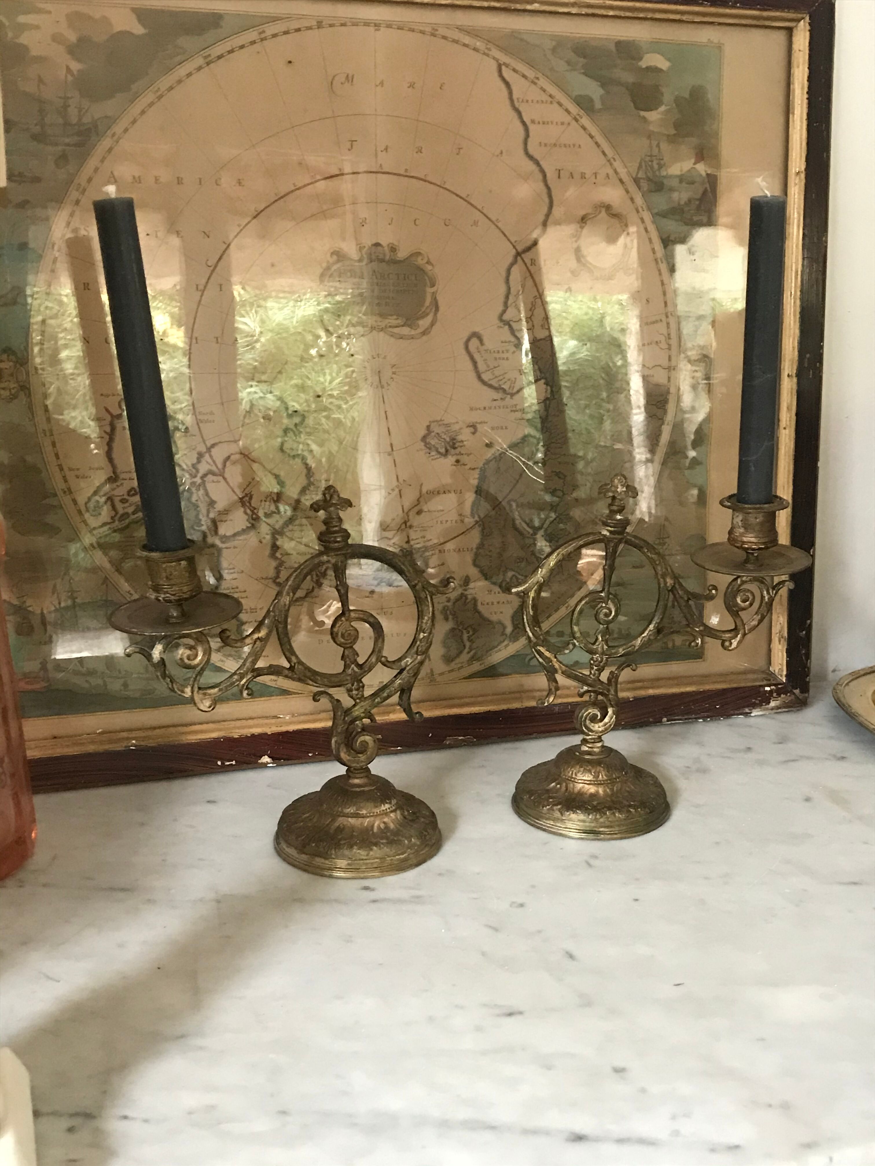 Pair of brass candlesticks with tassels