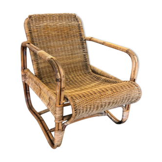 Old wicker rattan armchair