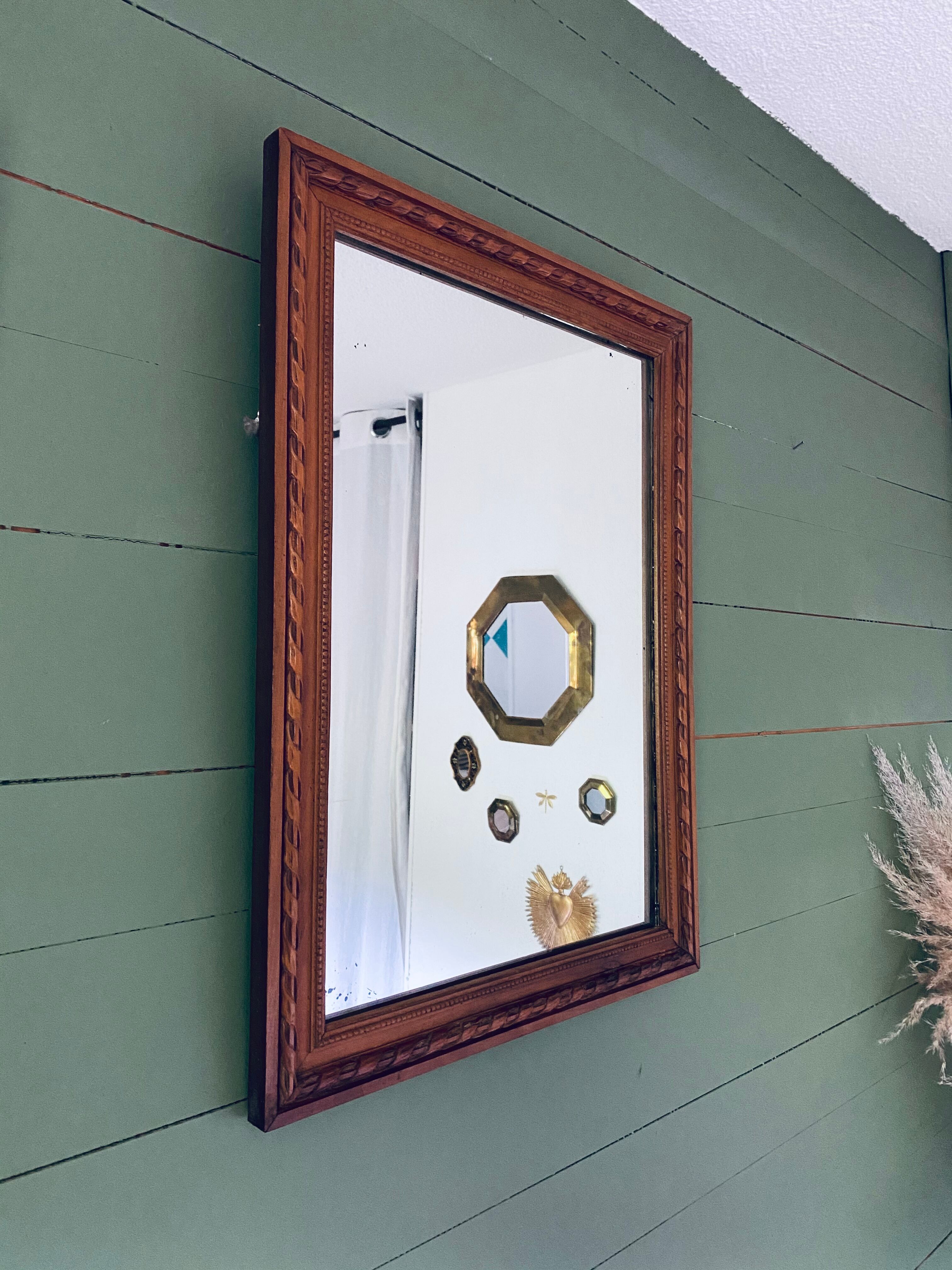 Antique mirror in carved wood and mercury 48x63cm