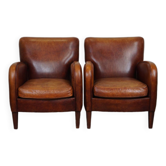 Set of 2 subtle sheep leather armchairs with a beautiful warm color scheme
