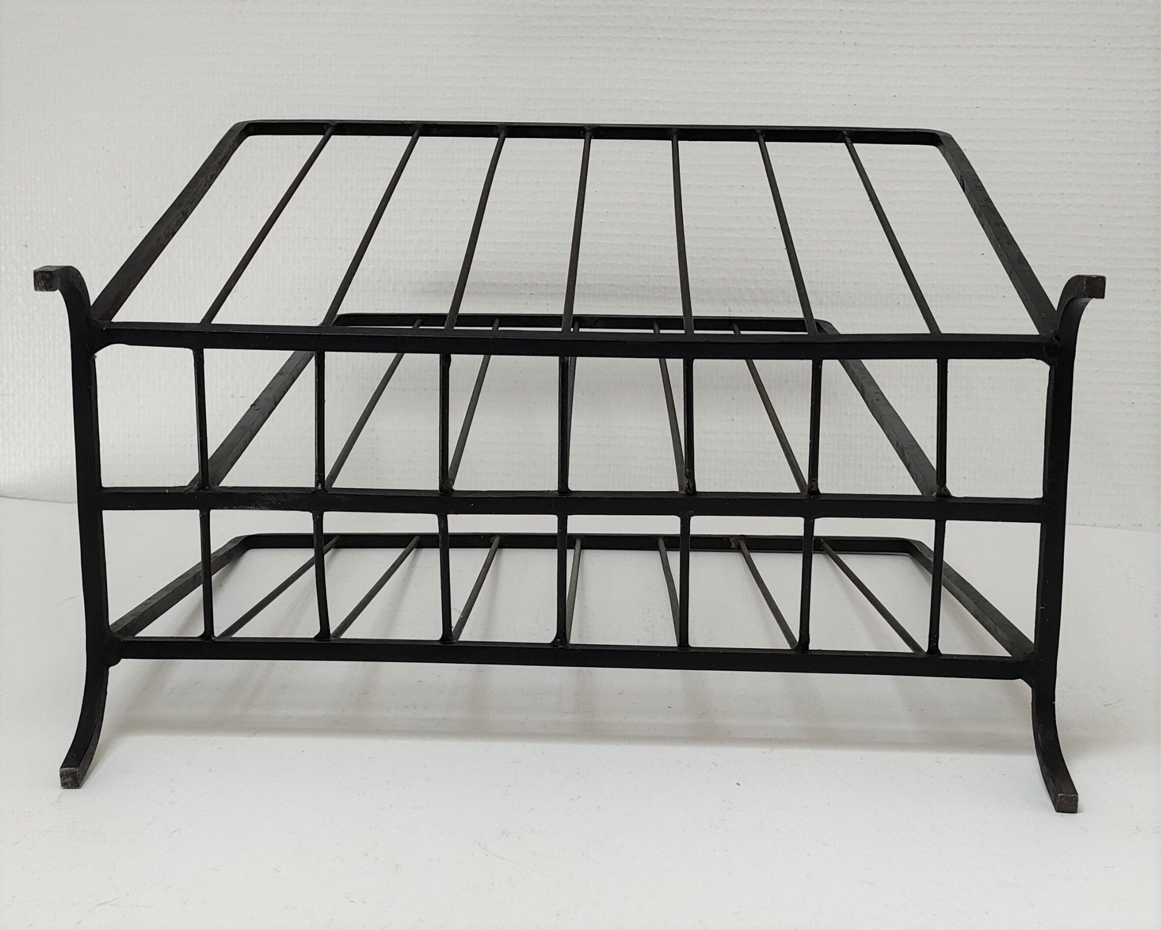 Modernist magazine holder black iron 60s