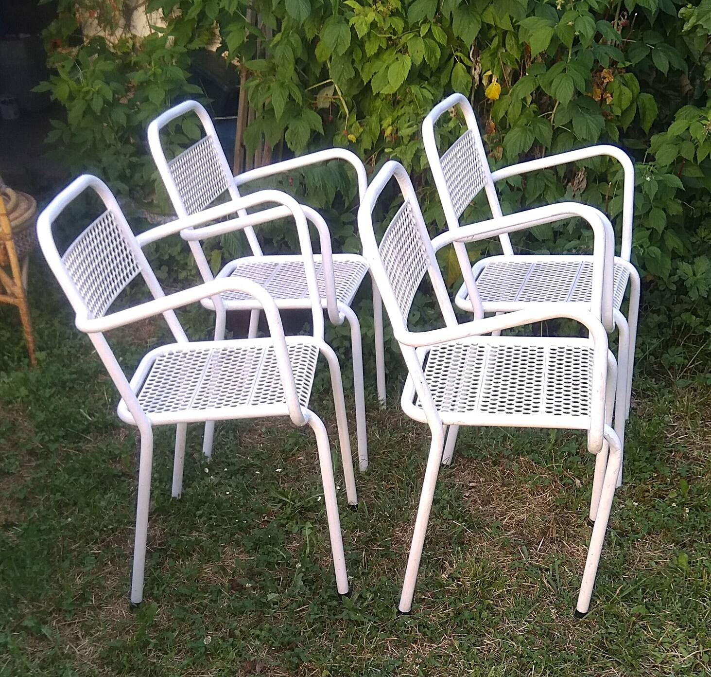Set of 4 stackable perforated garden armchairs