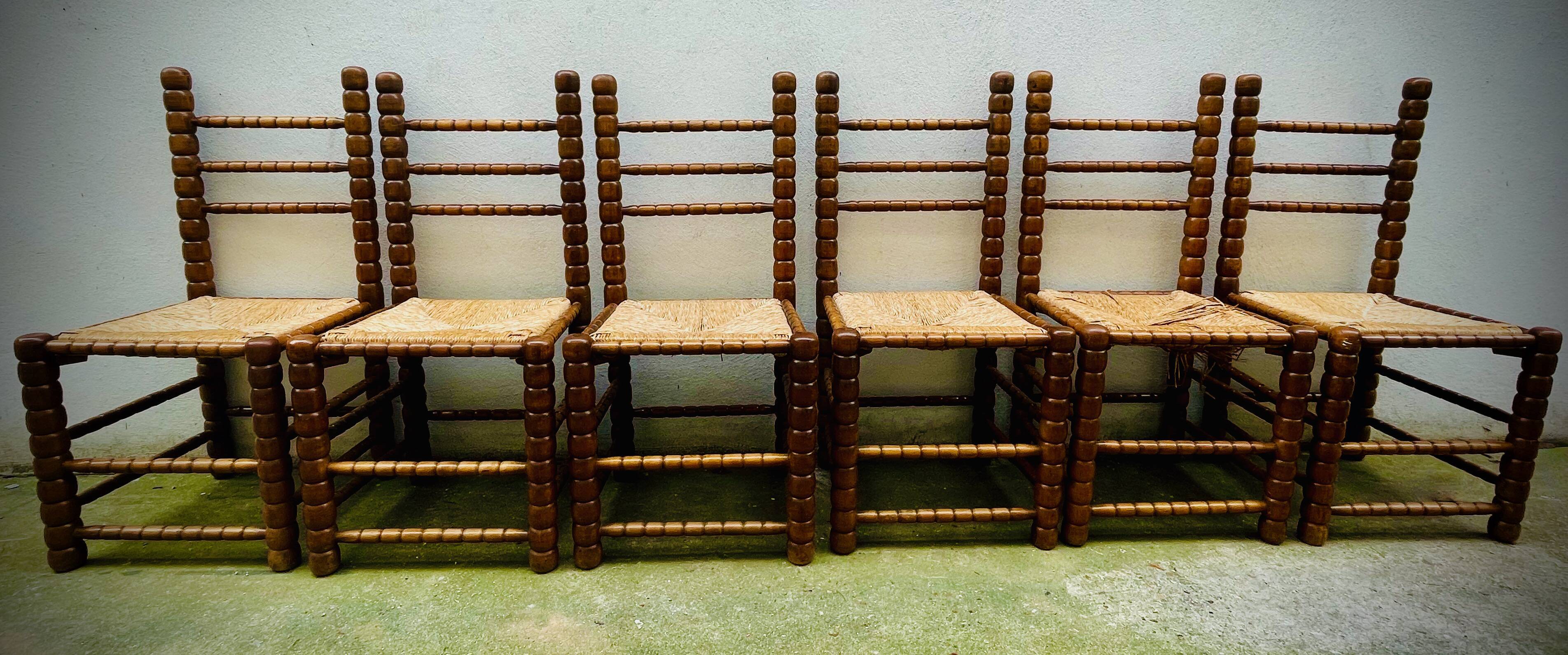 Brutalist chairs mulched in turned wood from the 60s