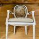 Upholstered armchair with cross-stitch in the Louis XVI style, 19th century.
