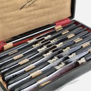 12 antique large table knives with ebony handles from the Napoleonic III period.