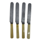 Set of 4 dessert knives with rounded tips and smooth ivory resin handles.