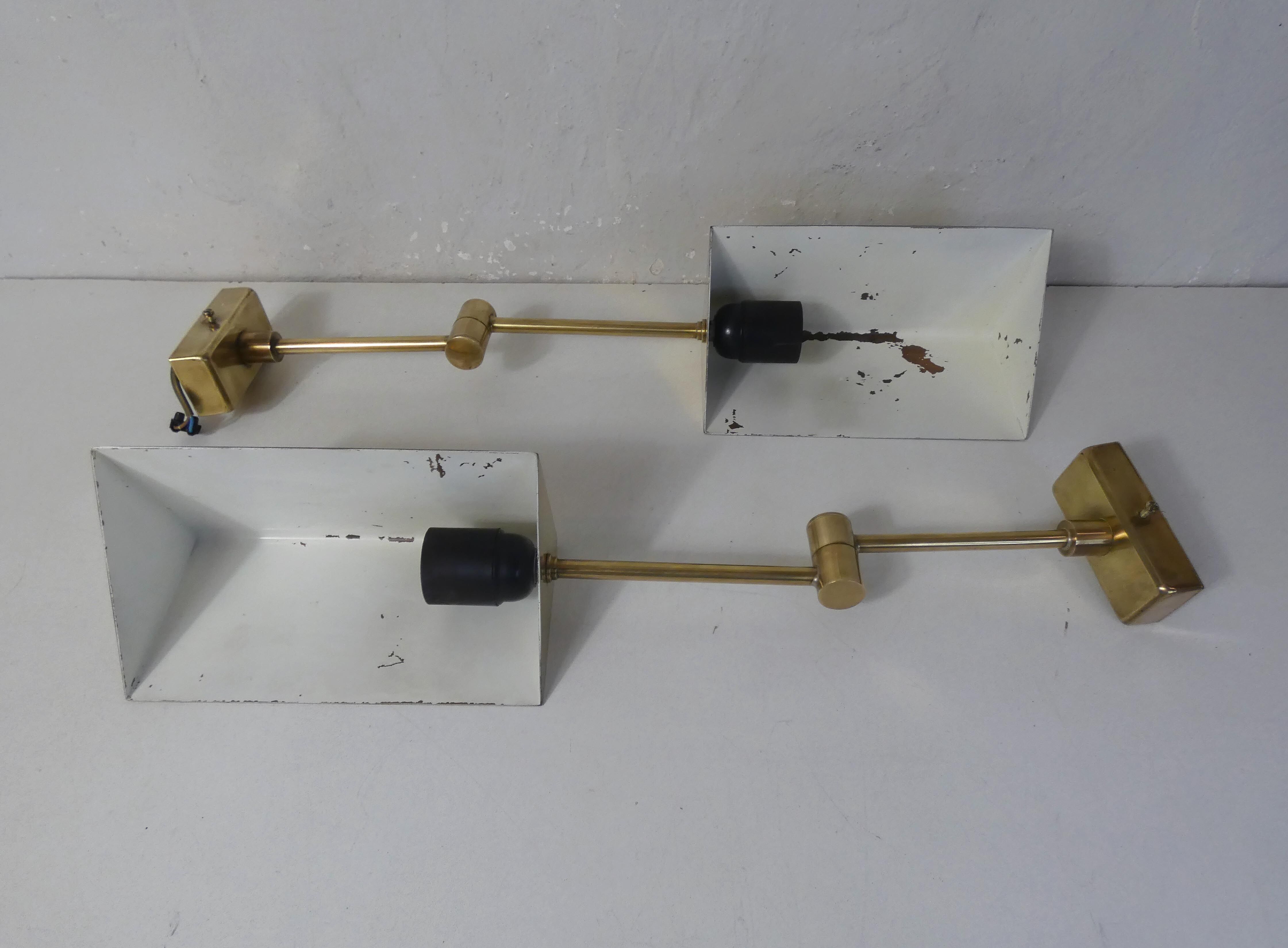 Pair of adjustable brass wall lamps after koch & lowy