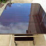 Chic serving table on wheels from the 60s with brass decorations and two shelves.