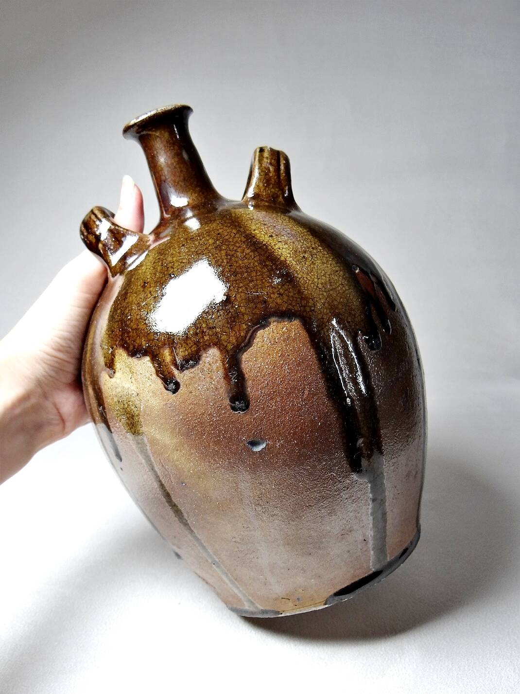 Old stoneware oil jar, glazed and enamelled, 2 handles