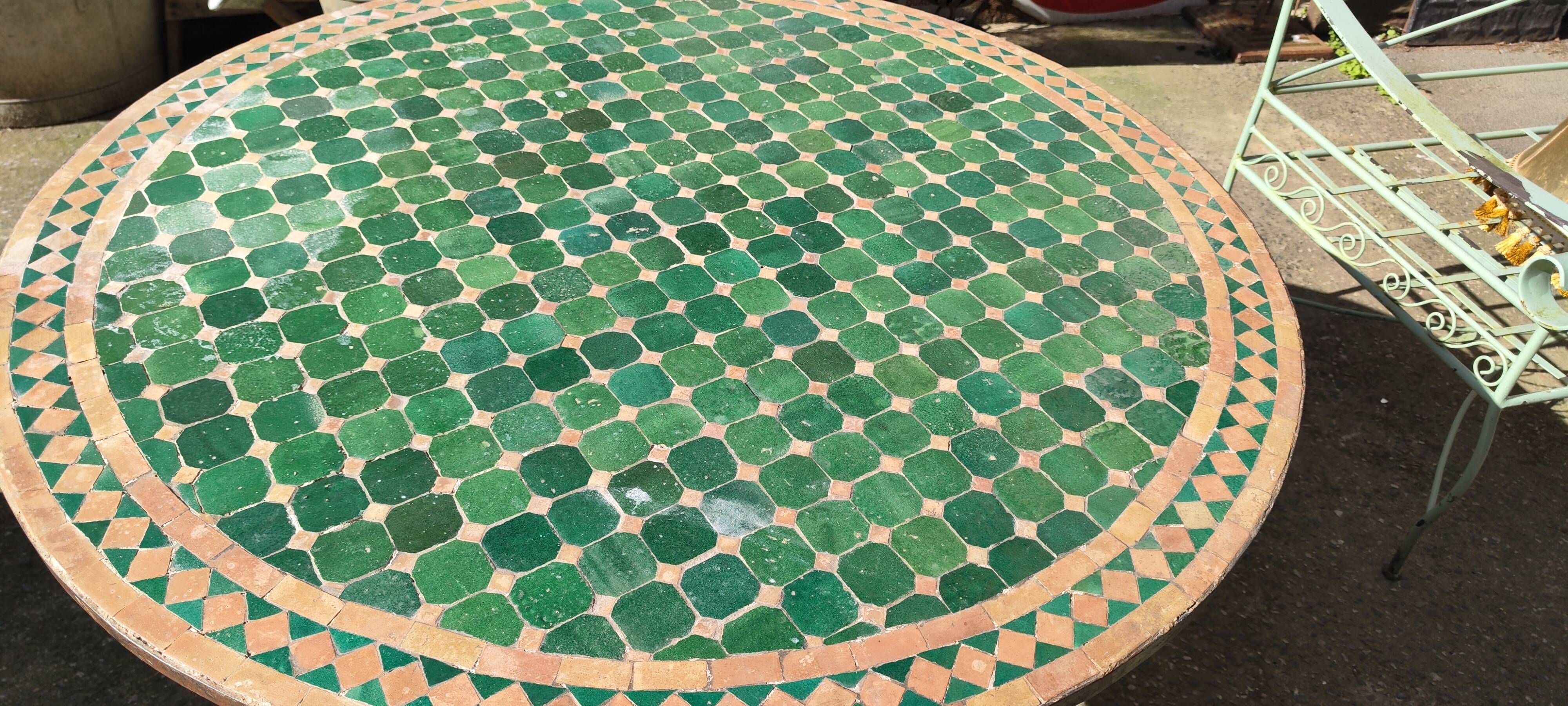 Round zellige table with metal legs and green tile top