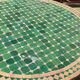 Round zellige table with metal legs and green tile top