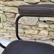 Brown faux leather armchairs
