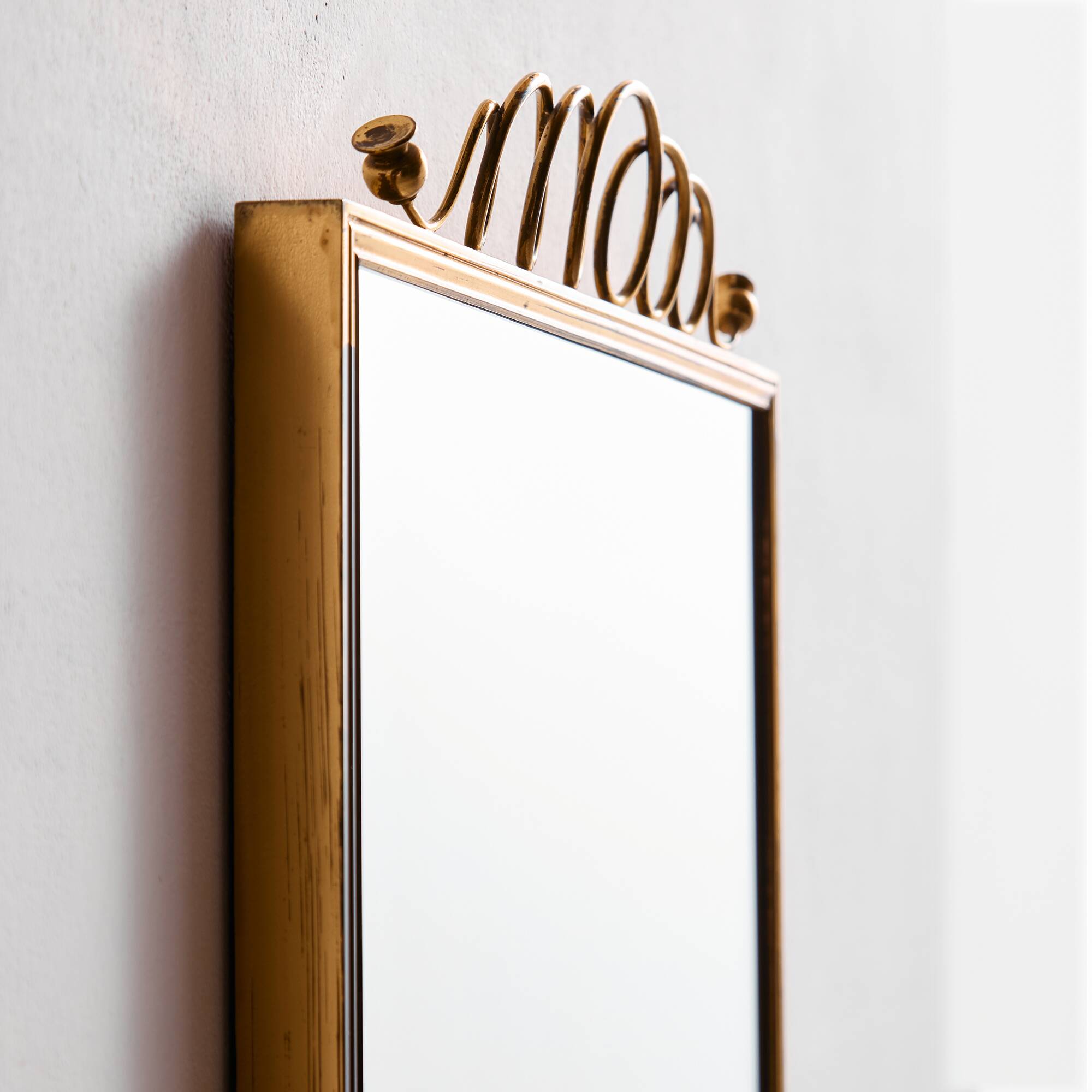 Metal and brass framed mirror