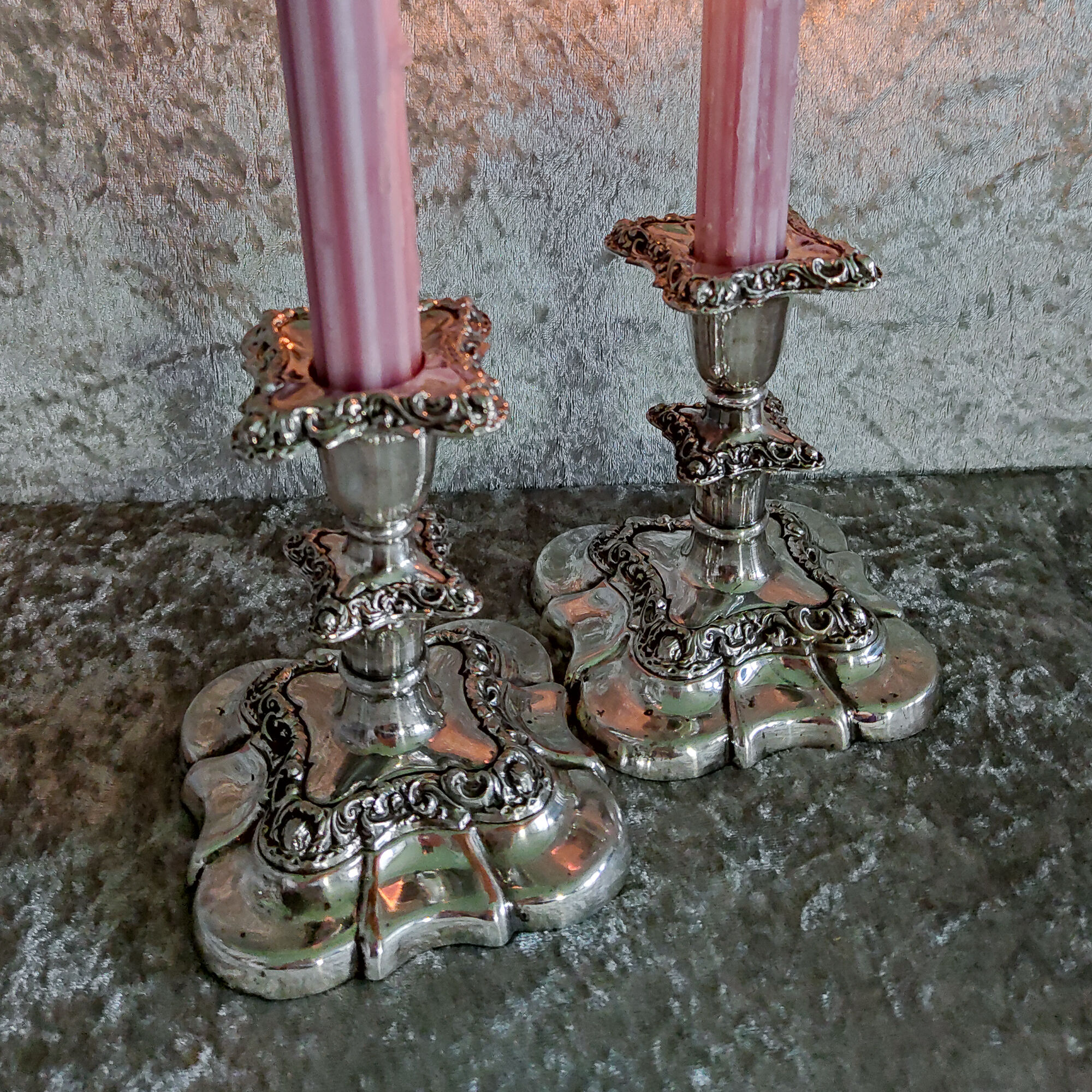 Pair of silver metal candle holders