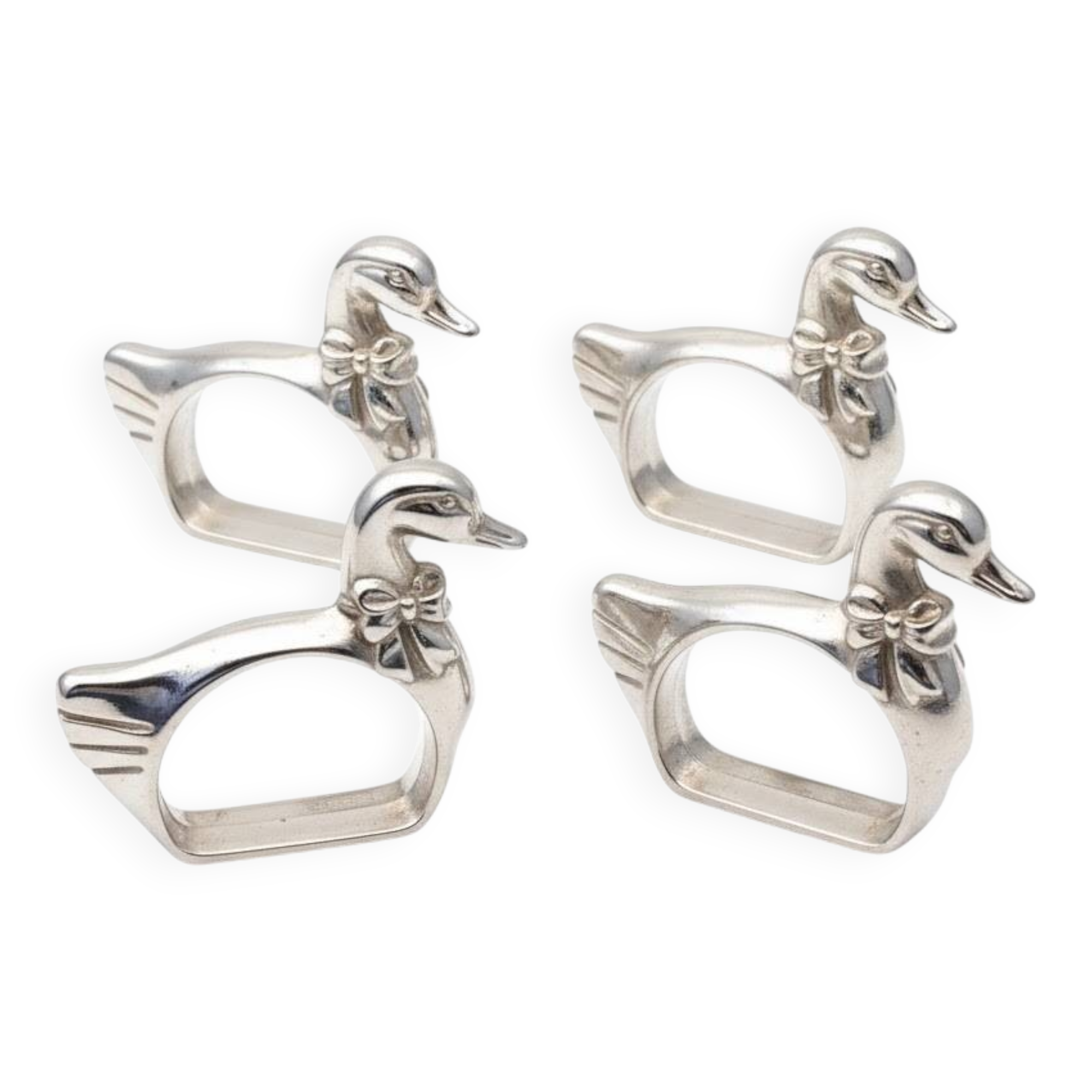 Four silver-plated napkin rings in the shape of a duck/goose