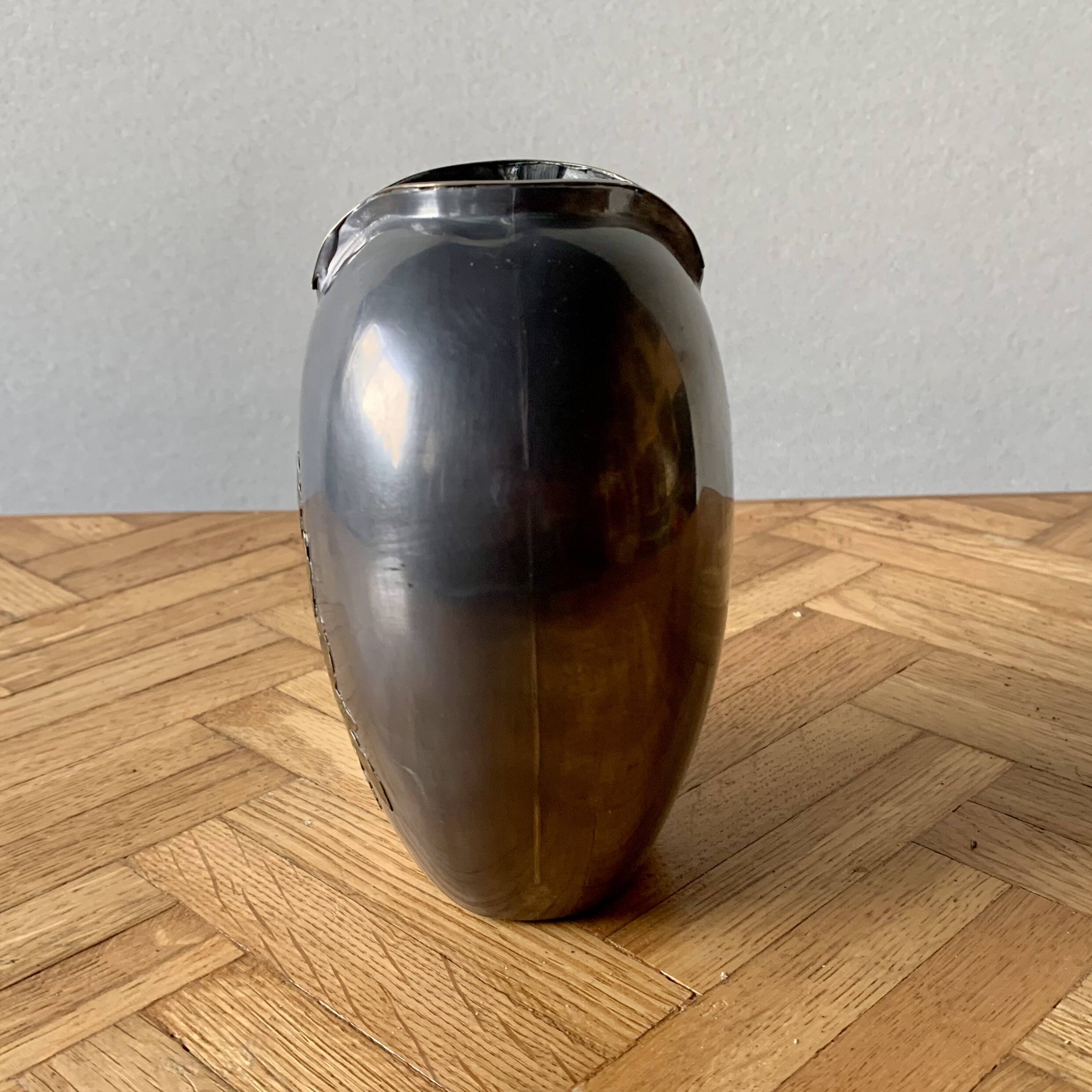 Small pewter vase decorated with brass flowers