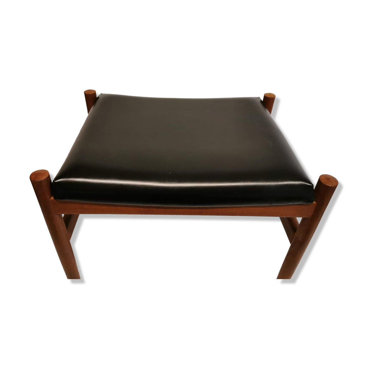 Danish designed footstool, in teak and black skai. Made at Spøttrup furniture factory in the 1960s.