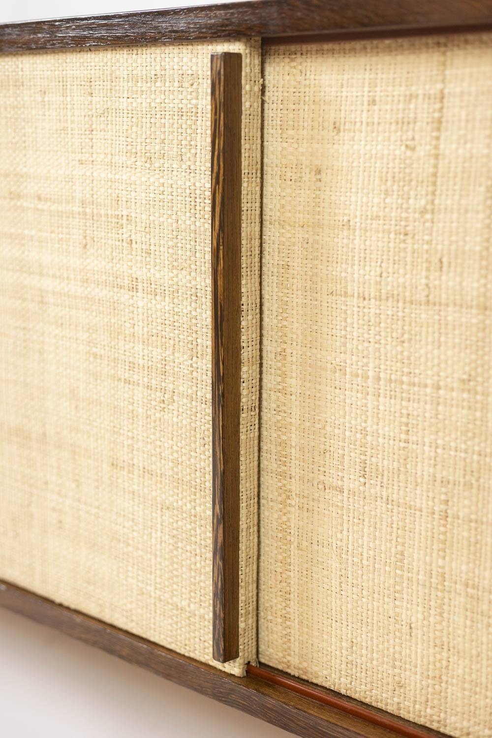 Sideboard in wenge, raffia and lacquered metal. 1970s.