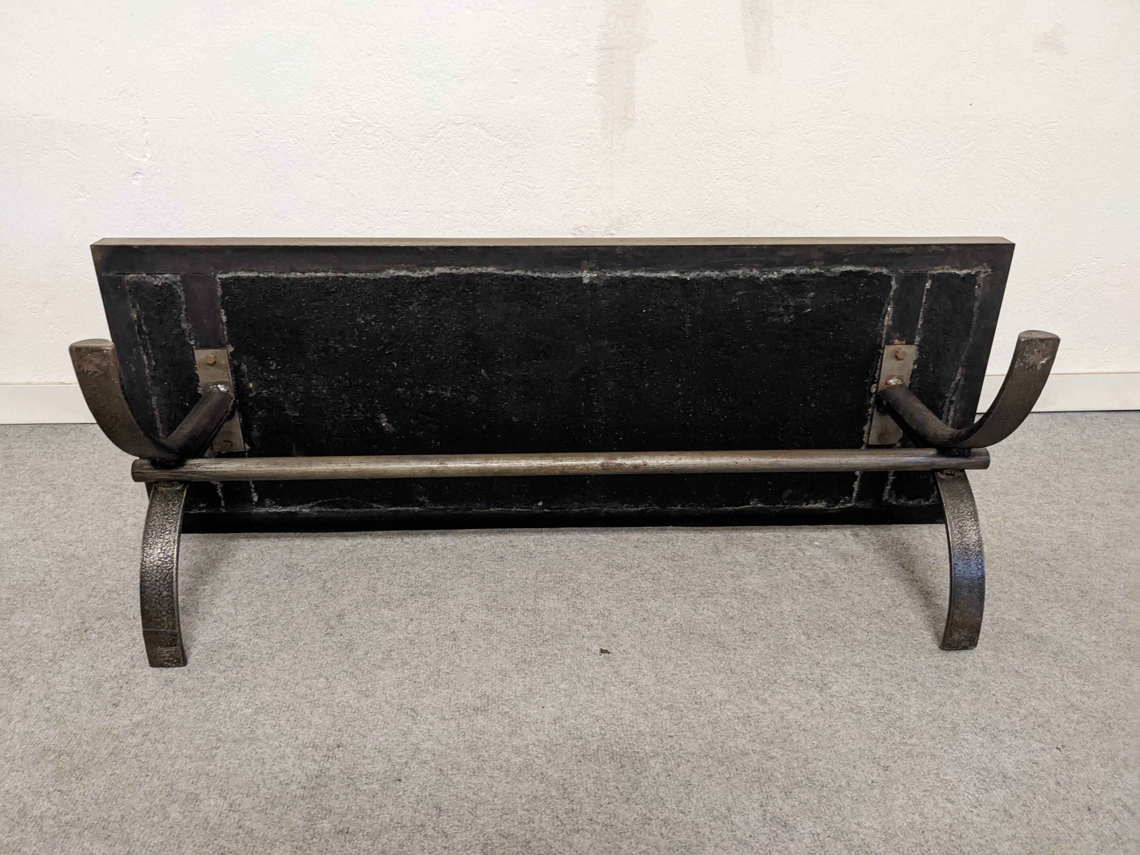 Brutalist coffee table in natural stone and wrought iron, France circa 1960.