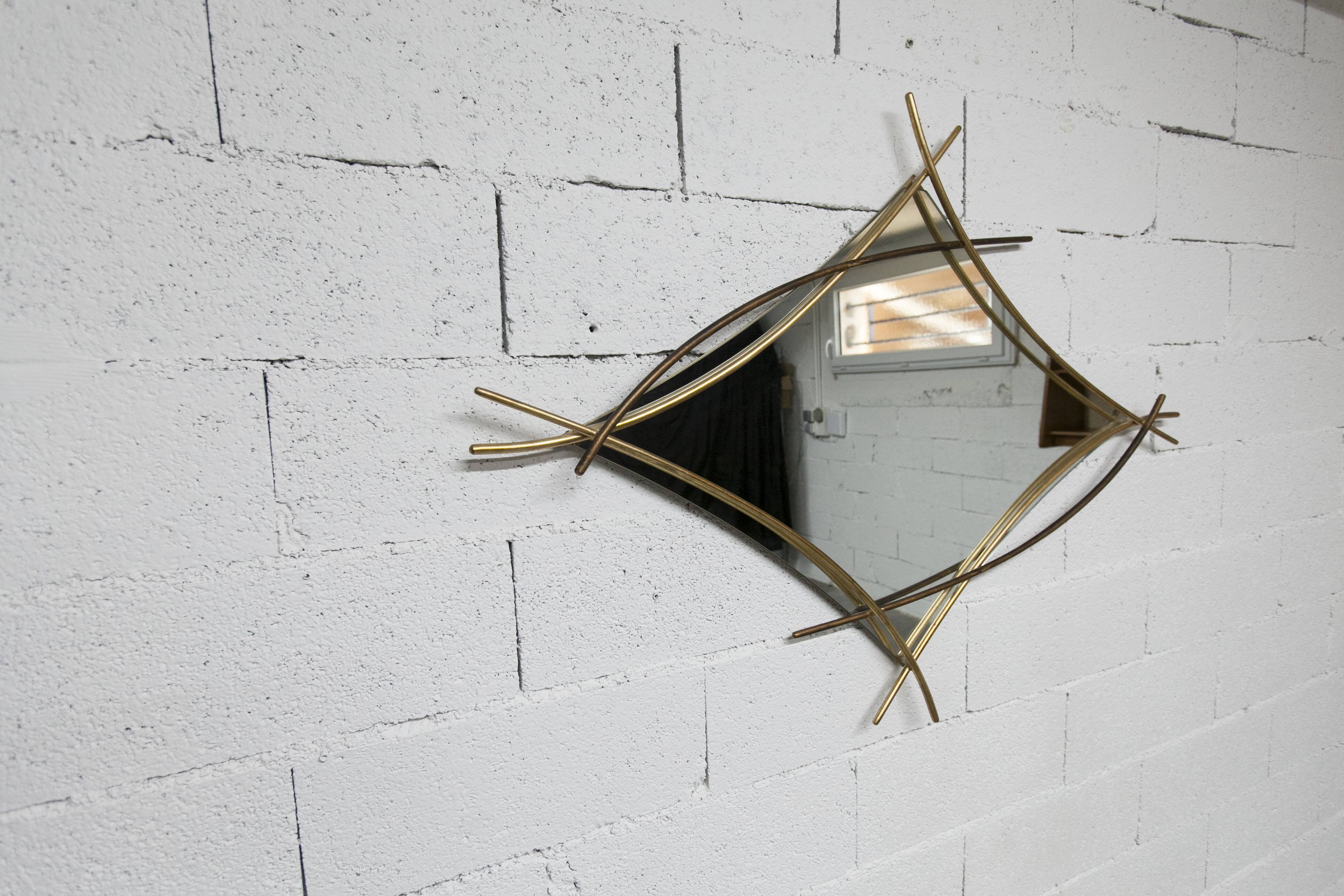 Sculptural mirror with two-tone gilded arches, France, 1970s, 95 x 133 cm