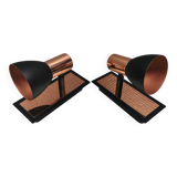 A pair of wall lamps from Eglo, in copper color and black.