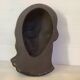 Bust head of a young woman in terracotta