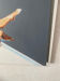 Seated woman painting