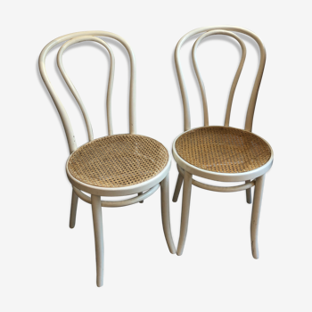 Couple of white bistro chairs