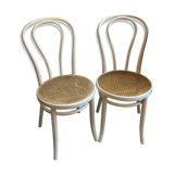 Couple of white bistro chairs