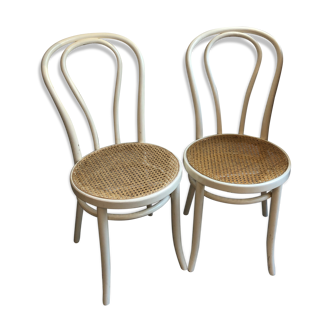 Couple of white bistro chairs