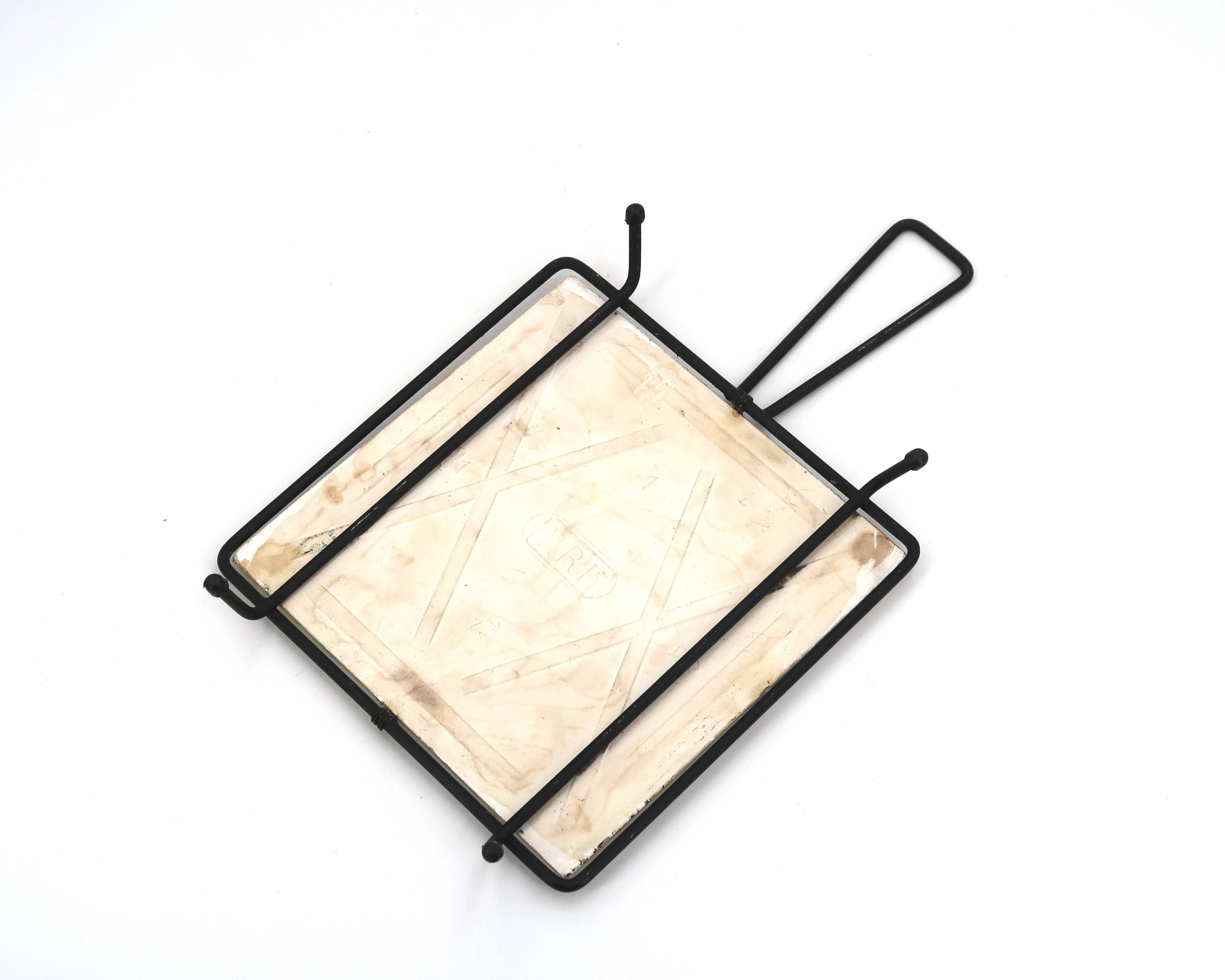 Square ceramic trivet with a bird by Jean Pierre Caffarelli.