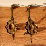 Pair of gilded bronze hooks Louis XVI style, nineteenth century.