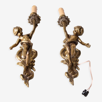 Pair of French bronze cherub sconces