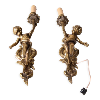 Pair of French bronze cherub sconces