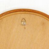 Rounded wall mirror in rattan 35x45cm
