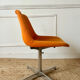 Chrome metal chair with orange fabric from the 70s.