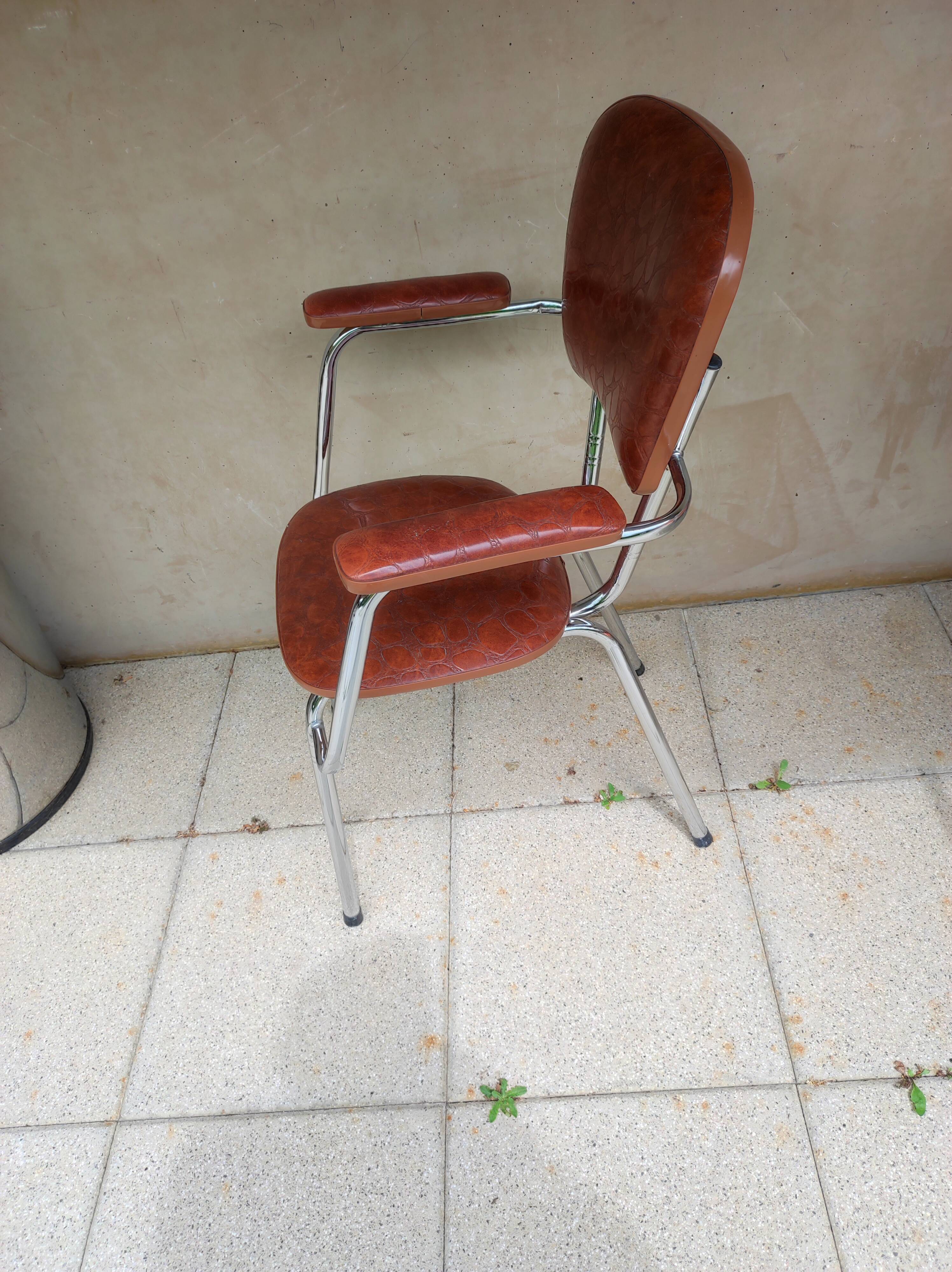 Stainless steel skaï armrest chair from 1958